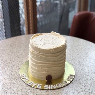 White cake with wavy buttercream texture and pearls, by DOT Cake Art