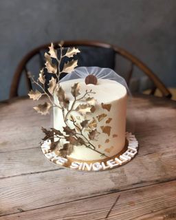 White cake with gold branches and bridal veil, by DOT Cake Art