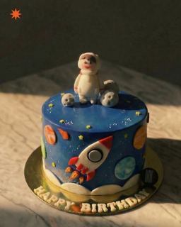 Blue space cake with rocket and astronaut, by DOT Cake Art