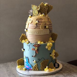 Two-tier Winnie the Pooh honey-pot cake with Tigger, by DOT Cake Art