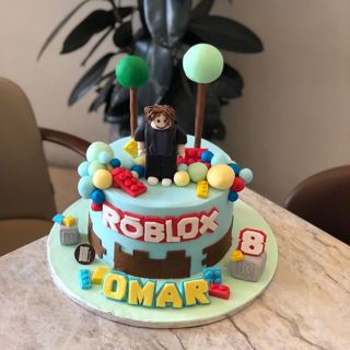Blue Roblox cake with blocks, character and trees, by DOT Cake Art