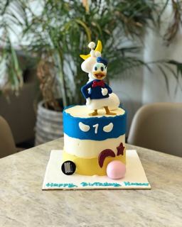 White and blue Donald Duck cake, by DOT Cake Art