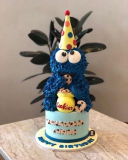Blue Cookie Monster cake with party hat, by DOT Cake Art