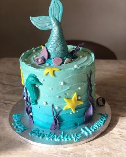 Teal mermaid cake with tail, starfish and seahorse, by DOT Cake Art