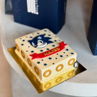 White sheet cake with Sonic and gold rings, by DOT Cake Art