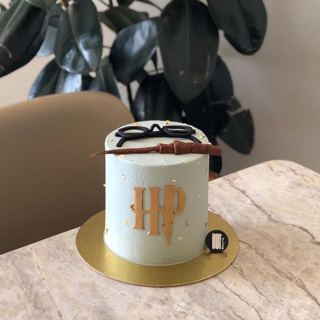 White Harry Potter cake with wand and glasses, by DOT Cake Art
