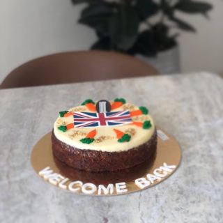 Carrot cake with UK flag, welcome back, by DOT Cake Art