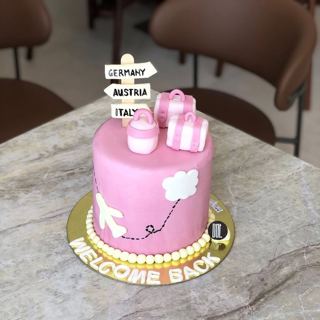 Pink cake with country signpost and gift boxes, by DOT Cake Art