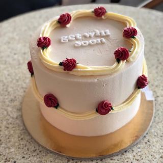 White cake with red roses and get-well message, by DOT Cake Art