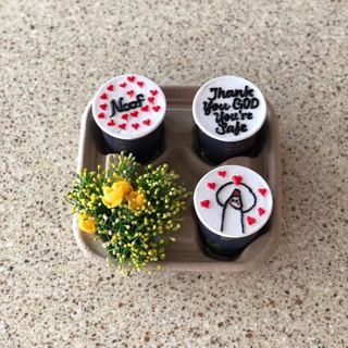 Four cup cakes with red hearts and yellow flowers, by DOT Cake Art