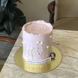 Soft pink cake with small flowers, by DOT Cake Art
