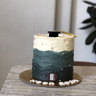 White and dark green cake with graduation cap, by DOT Cake Art