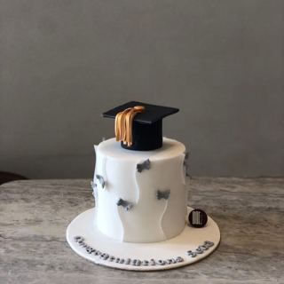 White cake with grey butterflies and grad cap, by DOT Cake Art