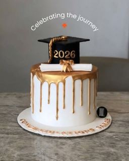 White cake with gold drip and graduation cap, by DOT Cake Art