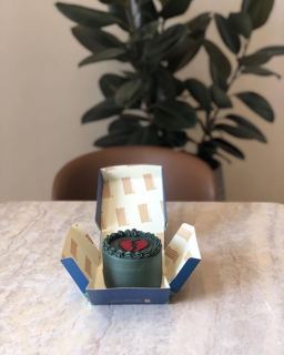 Small dark green cake with a red broken heart, by DOT Cake Art