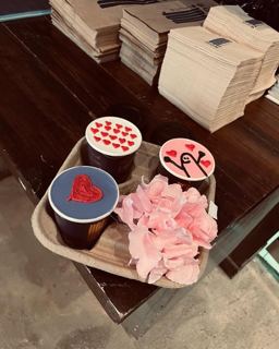 Three cup cakes with red hearts and pink flowers, by DOT Cake Art