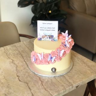 White cake with pink roses and butterflies, by DOT Cake Art