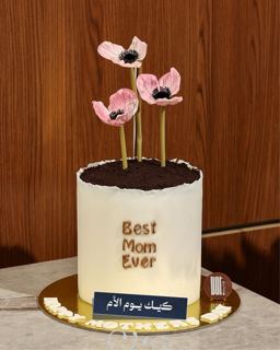 White flower-pot cake with pink blooms for mom, by DOT Cake Art