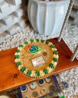 Giant cookie cake with National Day logo, by DOT Cake Art
