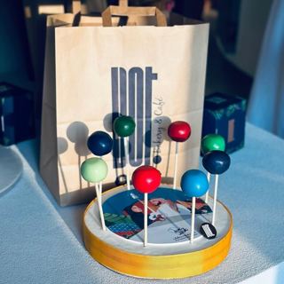 Green, red and blue cake pops for National Day, by DOT Cake Art