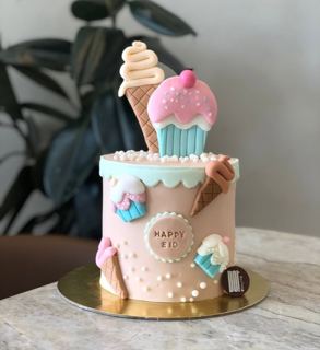 Pink Eid cake with ice cream and candy toppers, by DOT Cake Art