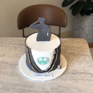White and grey cake with emblem and soldier silhouette, by DOT Cake Art