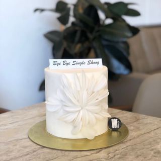 White cake with large petal design, by DOT Cake Art