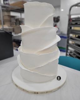 Two-tier white cake with wrapped layers, by DOT Cake Art