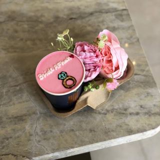 Mini pink cake with engagement ring and flowers, by DOT Cake Art